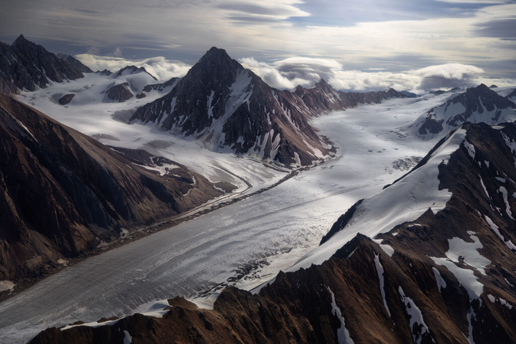 Mountain ridges surrounding glaciers and pointy mountain peaks