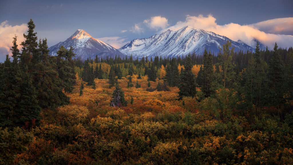 clouds roll over huge mountain during fall