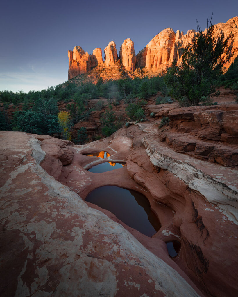 sunrise over desert mountains and pools