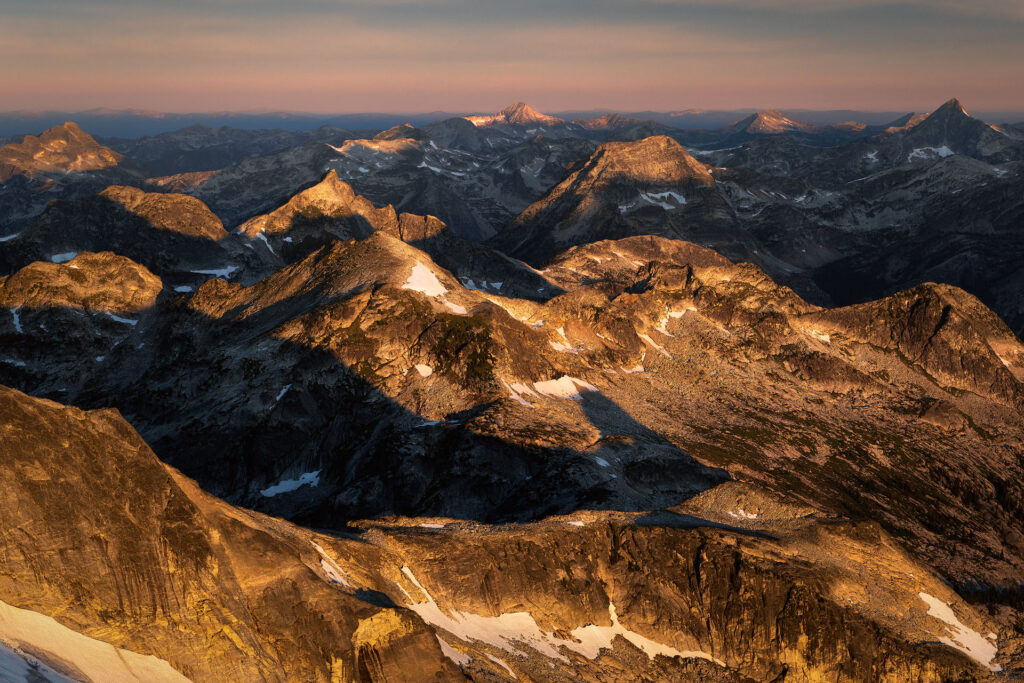 Mountain peaks light up at dawn