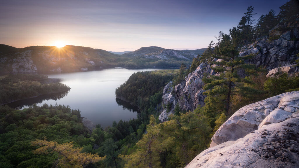 white cliffs over forested lake in Killarney Provincial Park