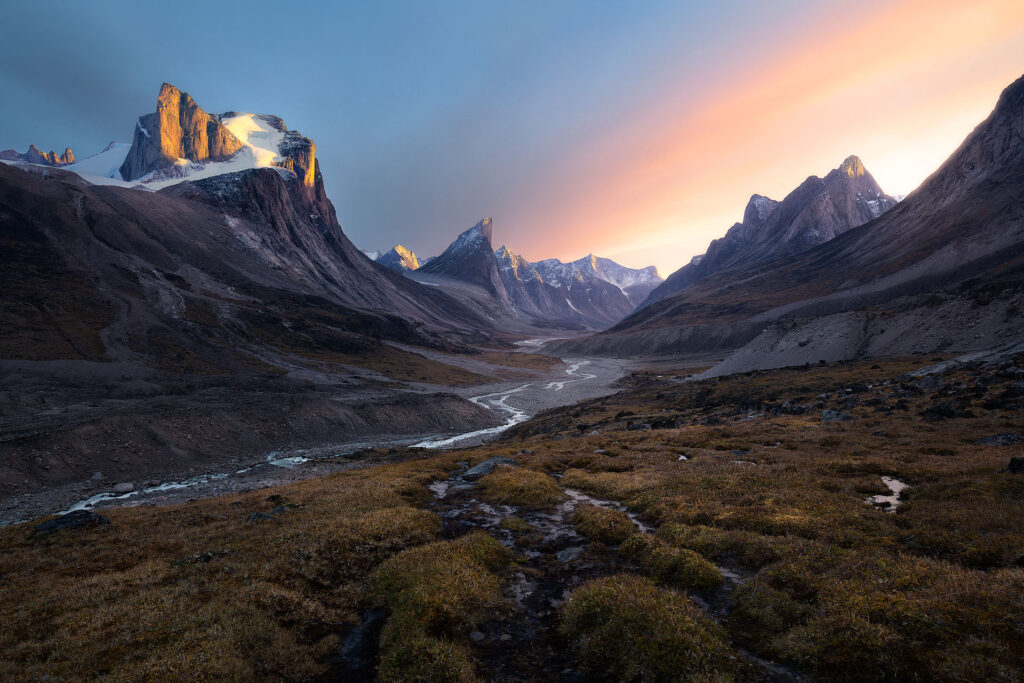 Dramatic valley of arctic peaks at sunset