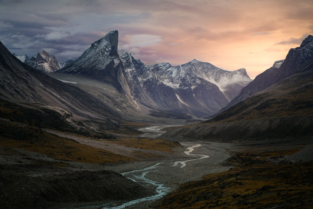 sunset light over dramatic arctic mountain peaks