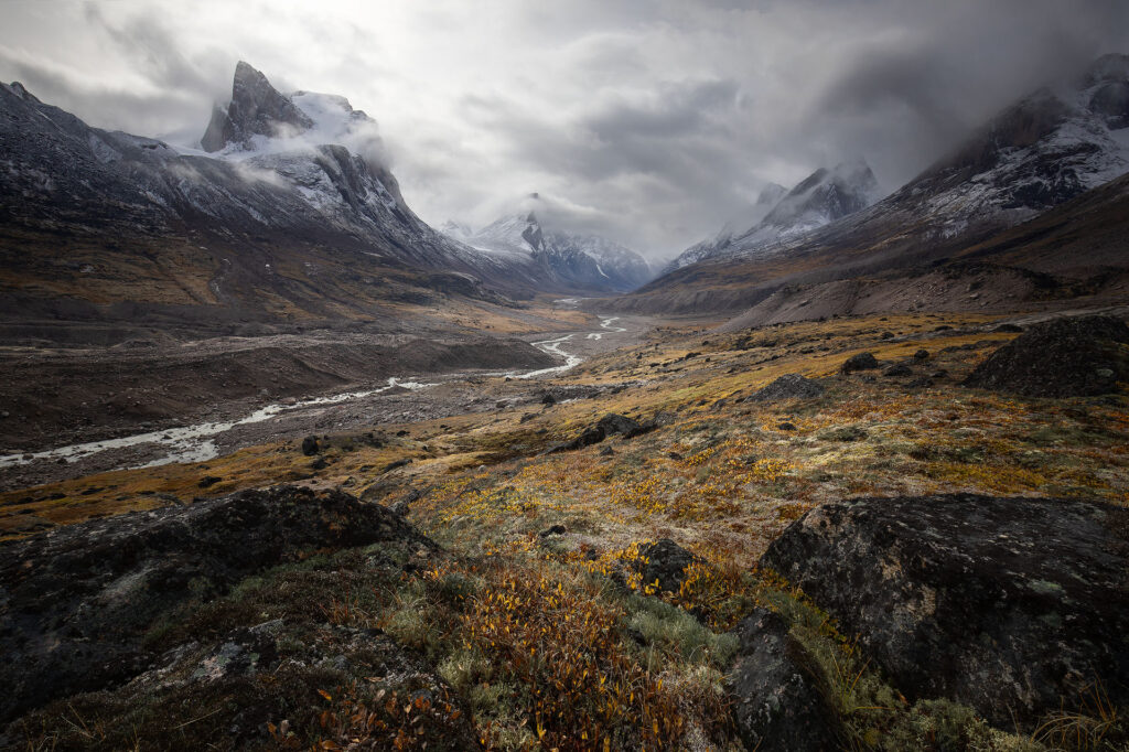 Fall arctic valley under heavy cloud