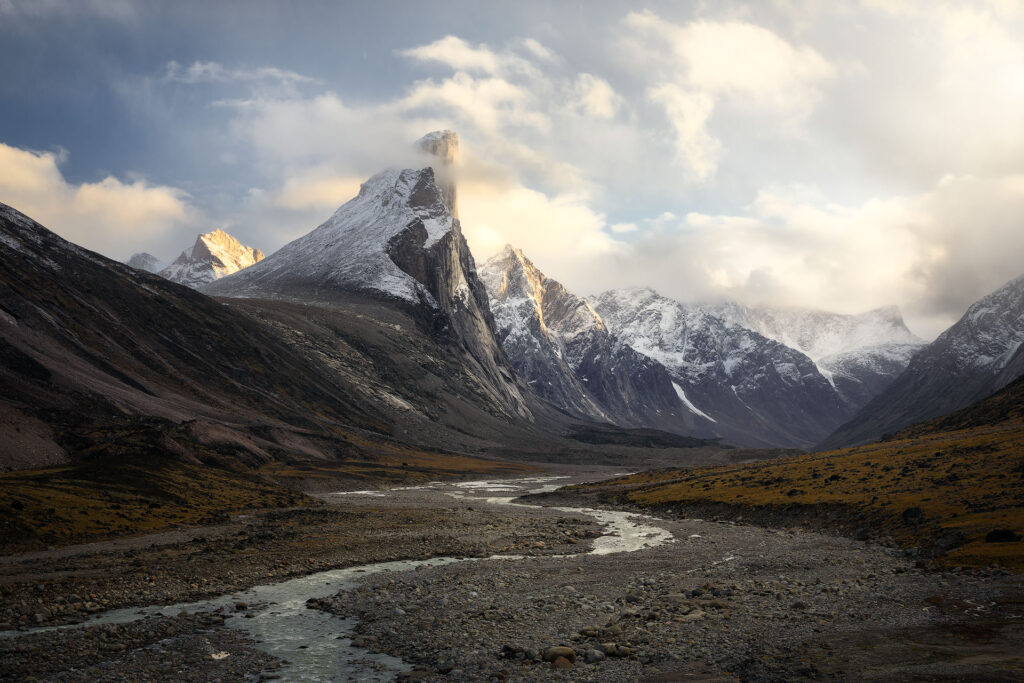 mount Thor breaking through dramatic clouds